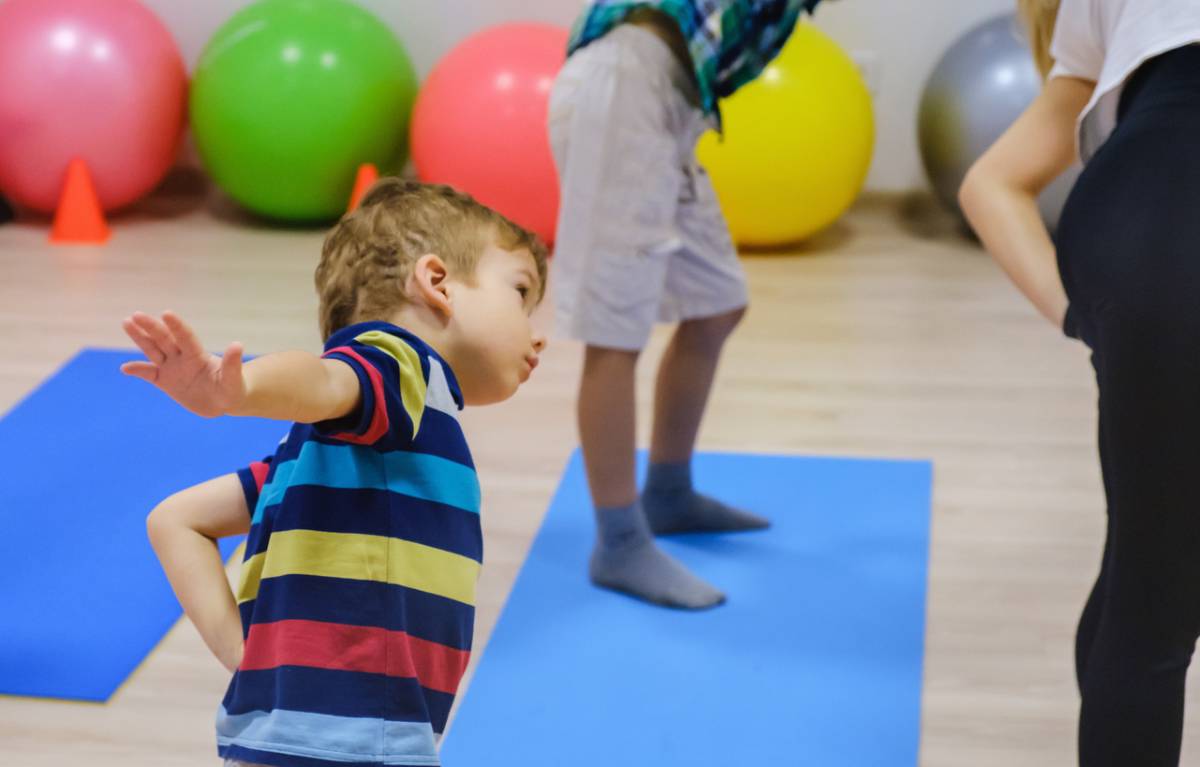 Happy sporty children exercise, fitness gym.